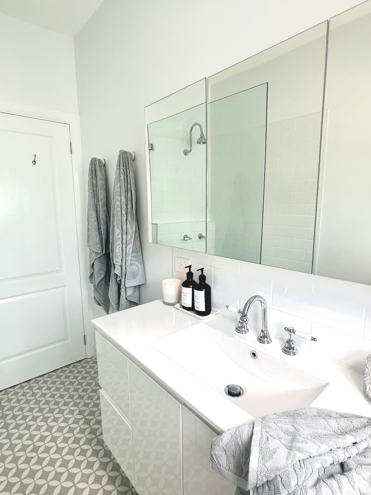 A renovated bathroom vanity with double sink